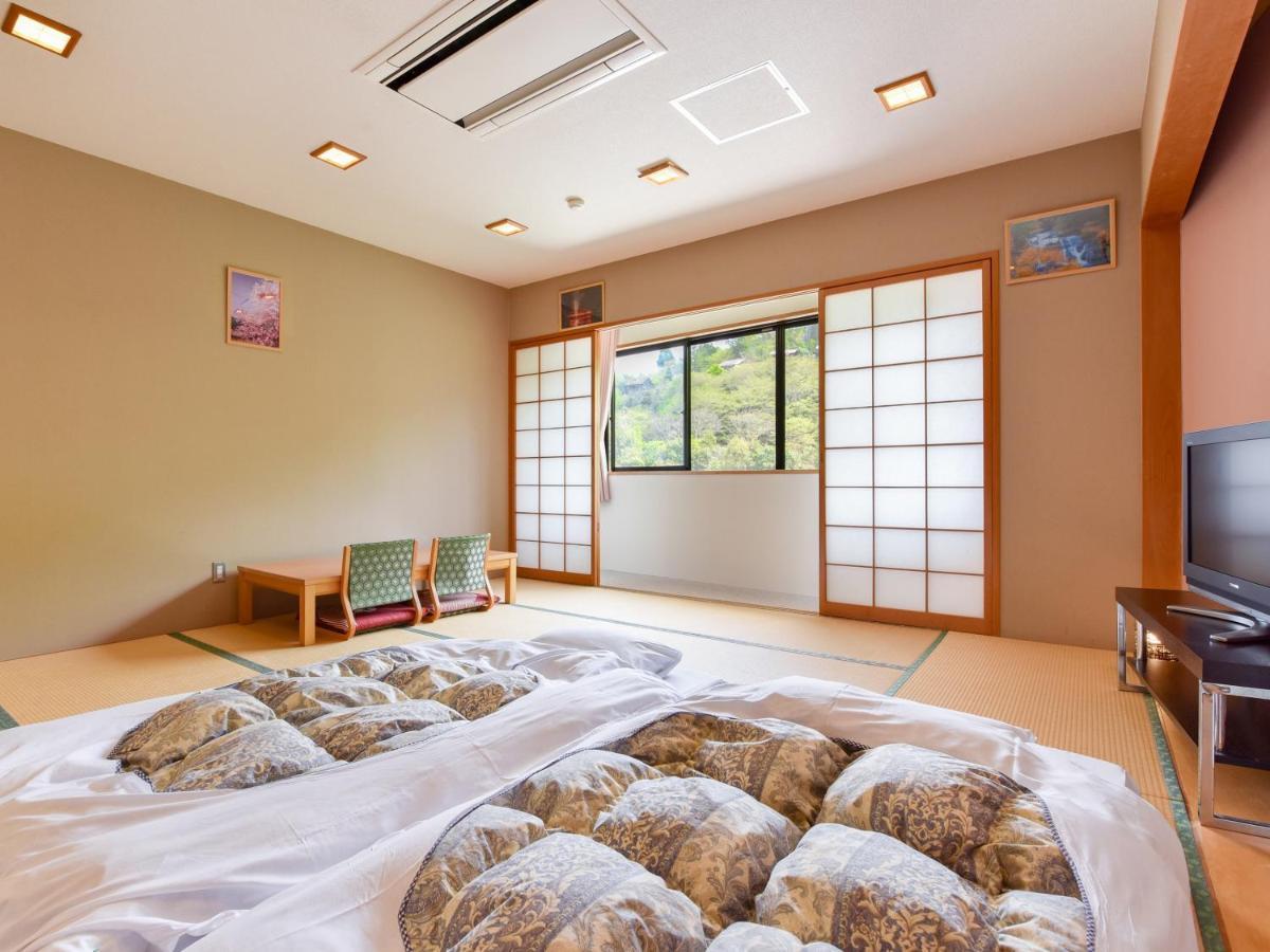 Отель Momijigawa Onsen Naka Экстерьер фото